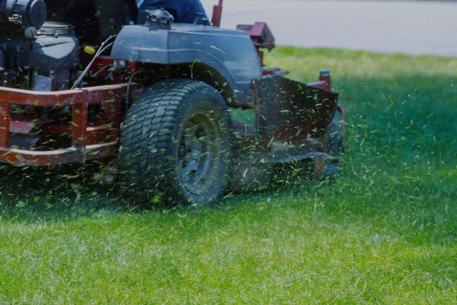 person mowing a lawn